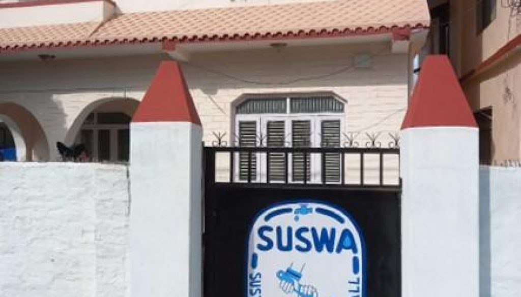 Picture of Surkhet office gate with SUSWA logo painted on it